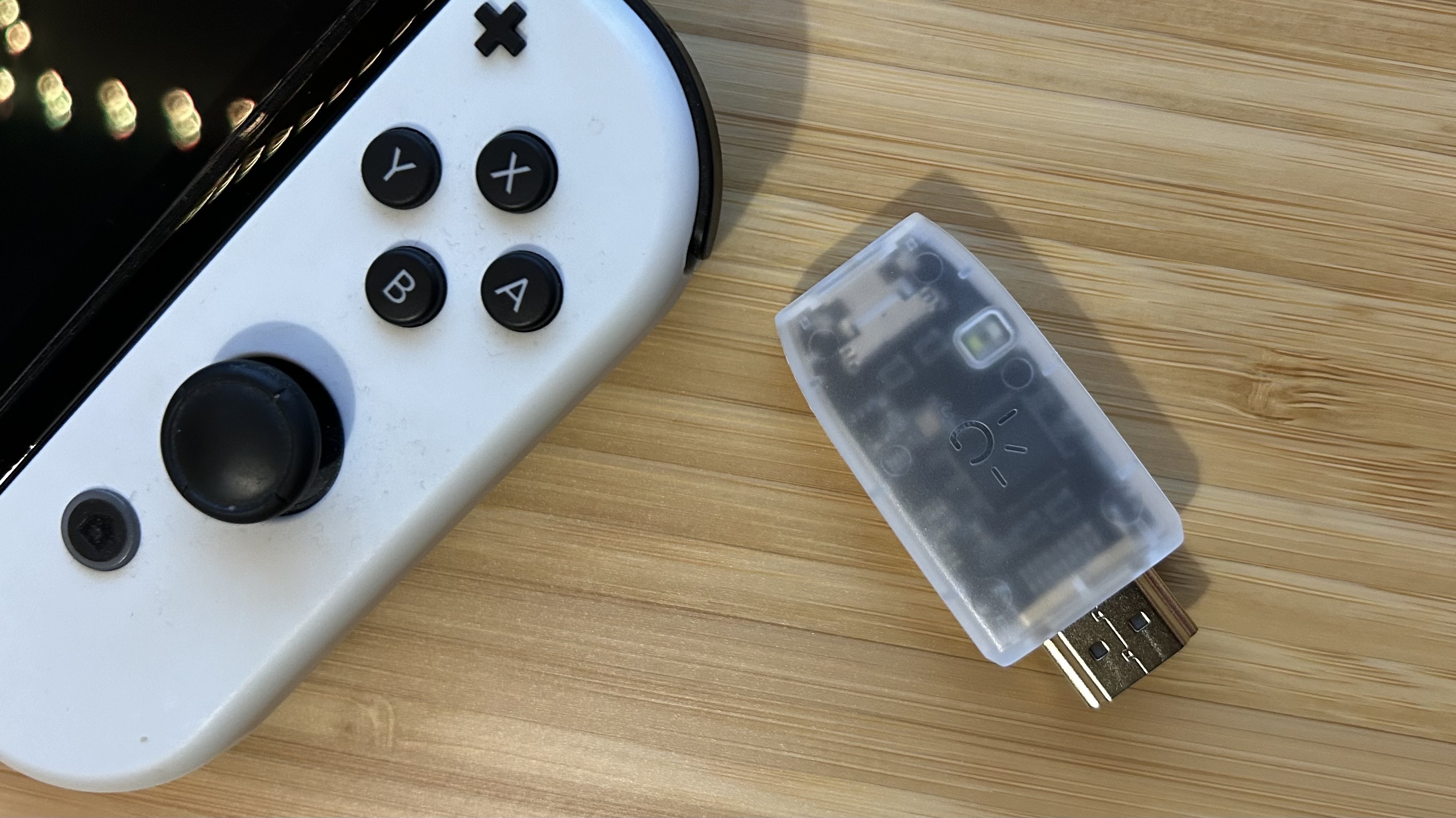 I use this cheap dongle to play Nintendo Switch on my iPad - and