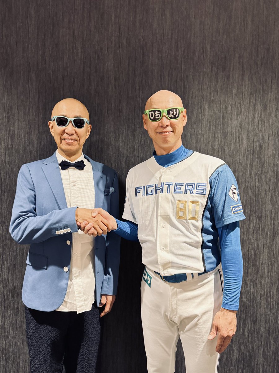 やっと会えて嬉しいです！」と固い握手を交わす森本稀哲コーチとサン